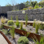 A clean, tiered garden made with corten steel edging