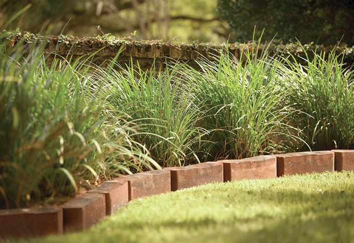 Brick border garden edging, a traditional option that creates a clear boundary between lawn and beds