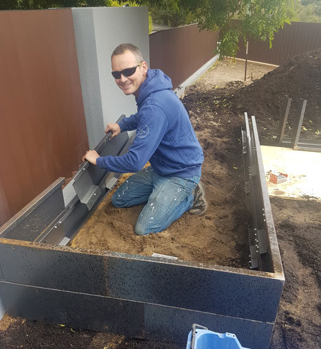 Building a DIY self-wicking garden bed from a steel tub: construction in progress