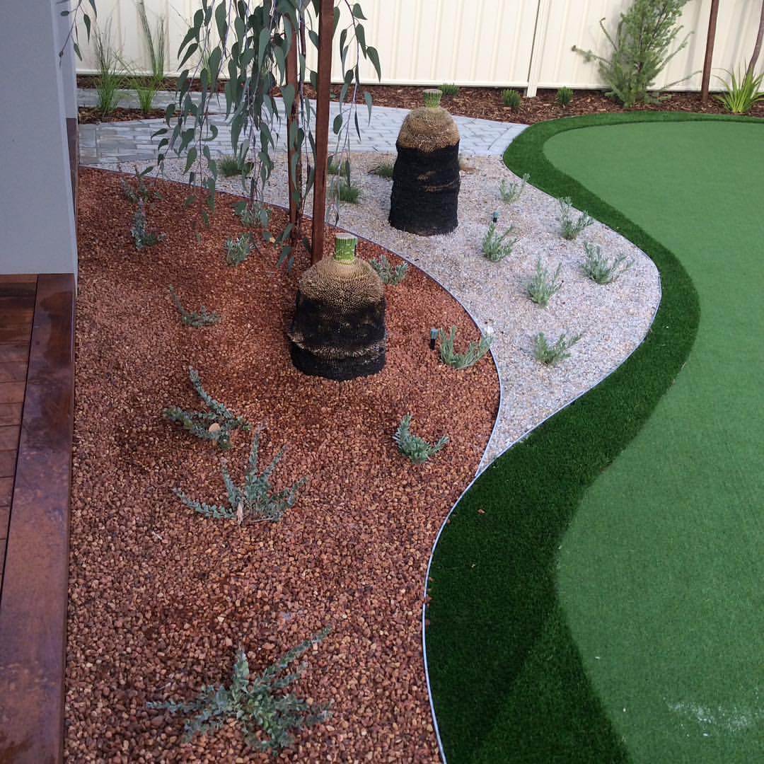 Corten steel garden edging creating a crisp, defined border, the material that stays sharp with less effort than alternatives