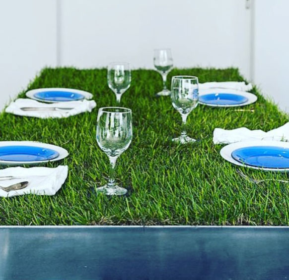 Grass-topped table as garden art, a playful use of lawn as a living sculptural element