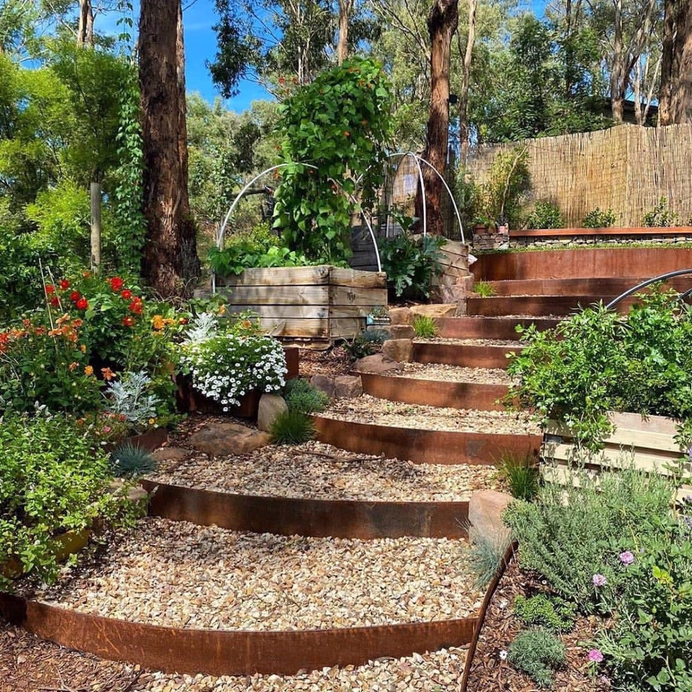 Professional steel raised bed edging with tiered levels, a high-end landscaping result