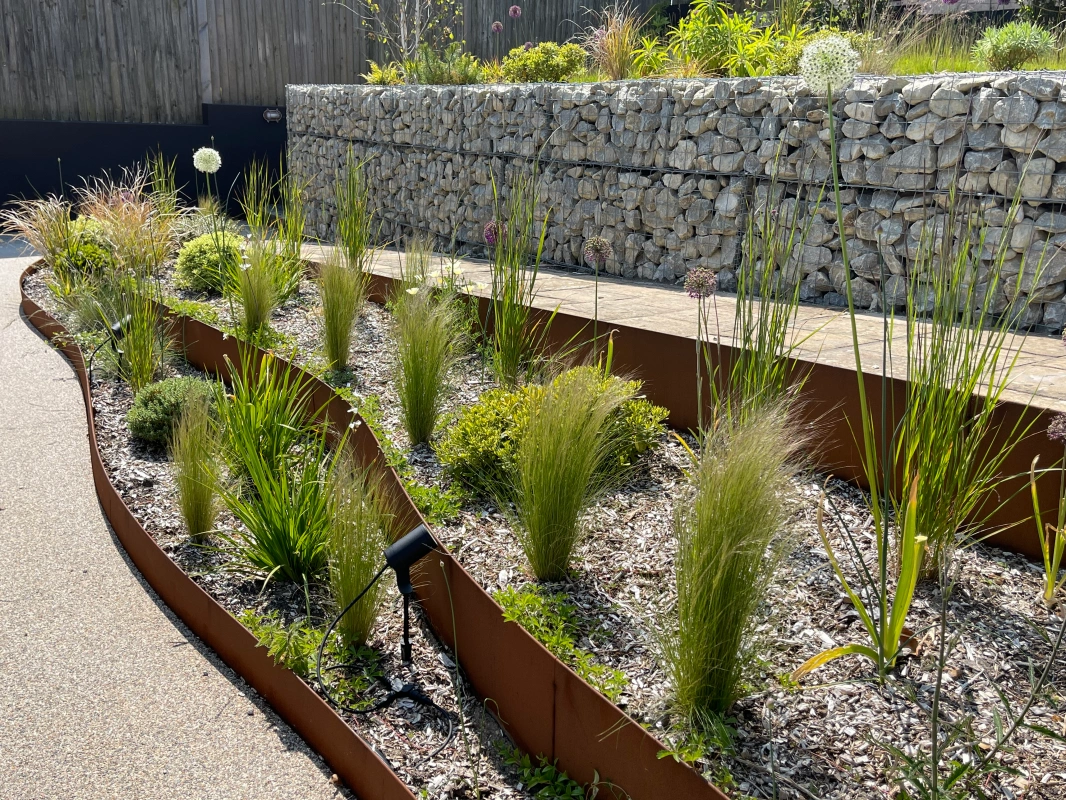 Straightcurve Flex weathering steel garden edging, designed for longevity in UK garden conditions
