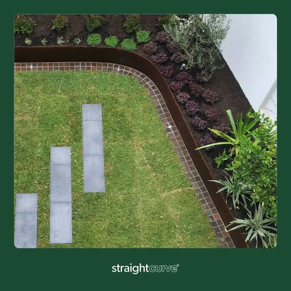 Straightcurve raised garden beds installed in a UK garden, the finished result before planting up
