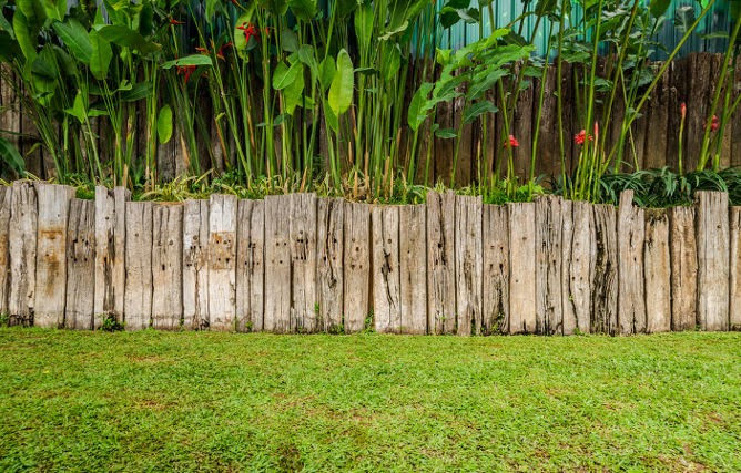 Timber sleeper garden edging, a popular choice, though shorter-lived than steel alternatives